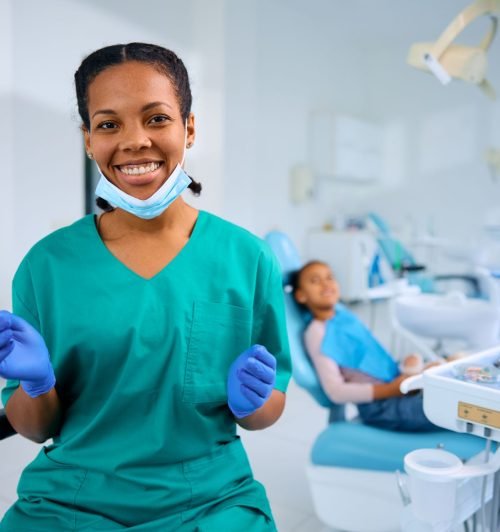 happy-black-female-dentist-at-work-looking-at-came-2024-12-13-17-09-34-utc.jpg